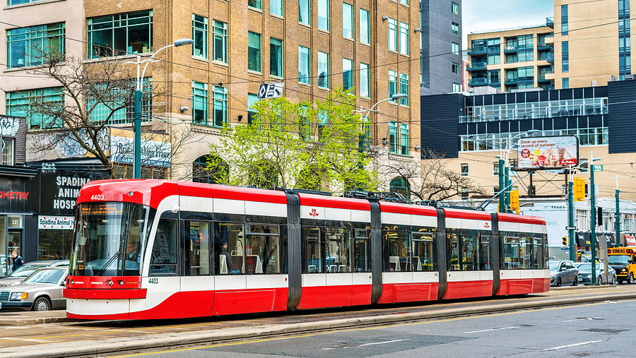 Various modes of transportation in a bustling Canadian city
